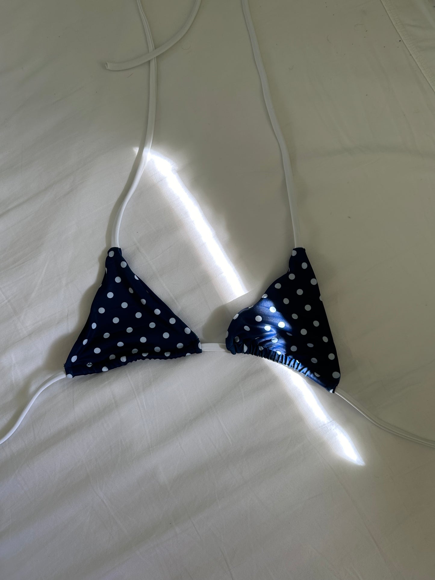 Navy polka dot triangle